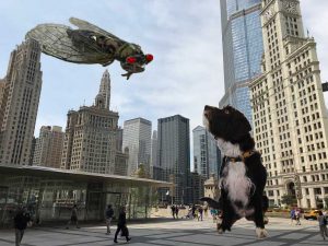 Cicada and dog wage titanic battle while far below, a city looks on with casual disinterest.